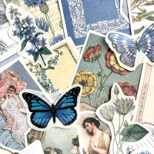 May include: A collection of vintage-style paper ephemera featuring blue butterflies, floral designs, and text. The ephemera is perfect for scrapbooking, card making, and other craft projects.