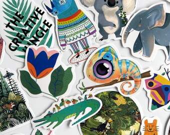 May include: A collection of colorful stickers featuring various animal illustrations, including a chameleon, a koala, an elephant, a rhino, and a flower. The stickers are on a white background and have a whimsical, cartoonish style. The text "The Creative Jungle" is featured on one of the stickers.