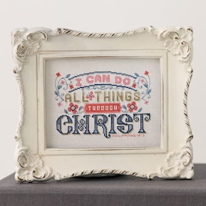 May include: White framed cross-stitch embroidery with the text "I can do all things through Christ" and the scripture reference "Philippians 4:13".