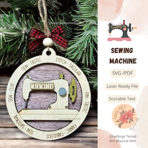 May include: A wooden ornament shaped like a sewing machine with the words "Sew-Cute", "Sew-Tastic", "Stitch-Tacular", "Pin-Tastic", "Fabric-Fabulous", and "Sew-Sational" around the edge. The ornament is decorated with a red and black plaid bow.