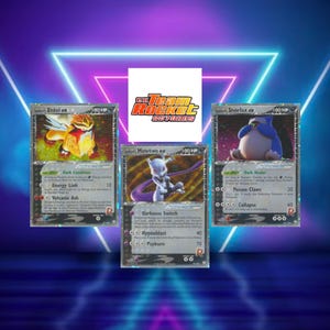 May include: Three Pokémon trading cards featuring Entei ex, Mewtwo ex, and Snorlax ex. The cards have a black and silver design with character illustrations and text. The "EX Team Rocket Returns" logo is visible.