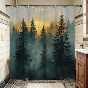 May include: A shower curtain depicting a forest scene with tall, dark green trees and a bright yellow sun setting behind them. The trees are silhouetted against the sky, and a misty fog fills the lower portion of the image. The curtain is hung in a bathroom.
