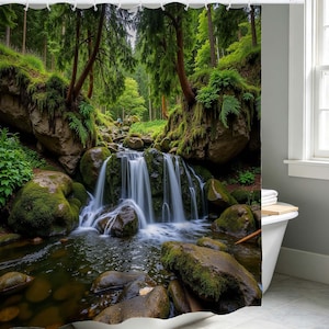 May include: Shower curtain featuring a scenic waterfall cascading over moss-covered rocks. Lush green trees and foliage frame the waterfall, creating a serene forest landscape. The curtain adds a natural, calming element to any bathroom.