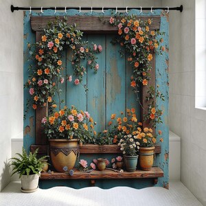 May include: A shower curtain featuring a rustic teal wooden door frame adorned with climbing orange and pink flowers. Below, three ceramic pots in varying sizes hold blooming orange and pink flowers, set against a weathered teal wood background.