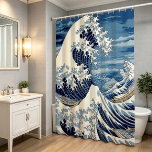 May include: A shower curtain featuring a large, stylised blue and cream wave design inspired by traditional Japanese art. The print depicts a towering cresting wave with foam details and small wooden boats navigating the turbulent water.