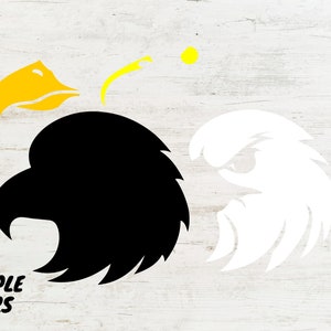 May include: A black and white layered design of an eagle's head. The eagle's beak is yellow. The design is suitable for crafting projects.
