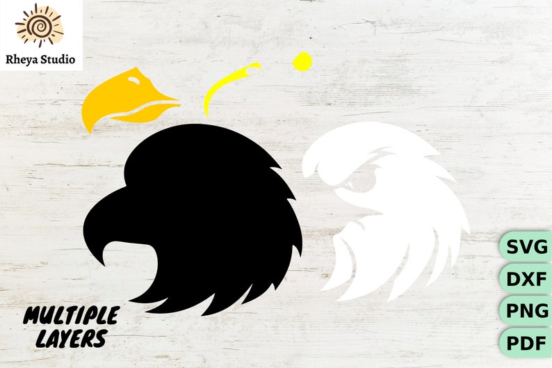 May include: A black and white layered design of an eagle's head. The eagle's beak is yellow. The design is suitable for crafting projects.