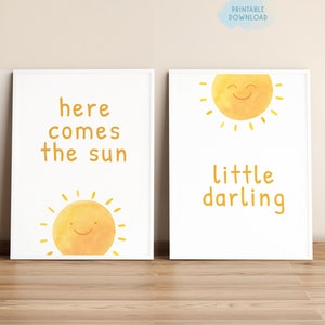 May include: Two printable nursery art prints with a yellow sun and the text "here comes the sun" and "little darling".