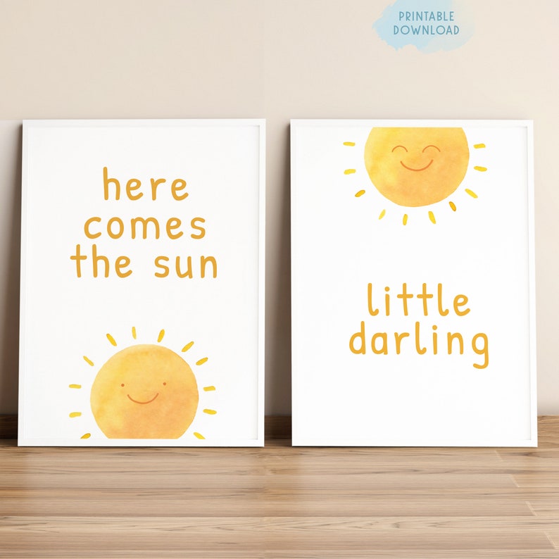 May include: Two printable nursery art prints with a yellow sun and the text "here comes the sun" and "little darling".