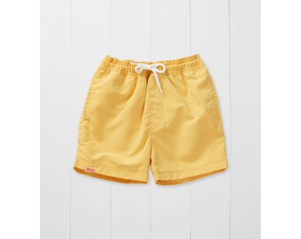 Grass & Air ochre yellow woven microfibre swim shorts for babies, toddlers, and kids, UPF50+ protection, Eco Fabric