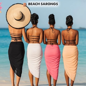 May include: Four women on a beach, wearing sarongs in black, white, pink, and peach. They are wearing black halter tops. One woman holds a large straw hat. The text "BEACH SARONGS" is at the top.