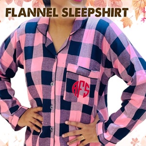 May include: A pink and black plaid flannel sleepshirt with a red monogram "AFS" on the pocket.