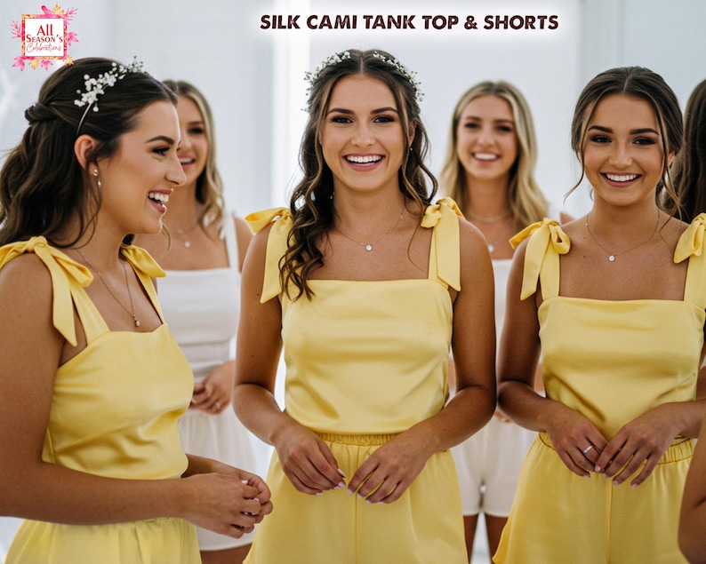 May include: Five women wearing yellow silk cami tank tops and matching shorts. The tops have adjustable straps with bows. The women are smiling and looking at the camera. The text "SILK CAMI TANK TOP & SHORTS" is at the top of the image.