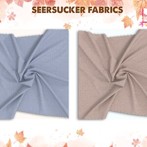 May include: Two swatches of seersucker fabric. One is light blue with white stripes, and the other is tan with white stripes. The fabric is gathered and draped, showcasing the texture. The words "SEERSUCKER FABRICS" are at the top.