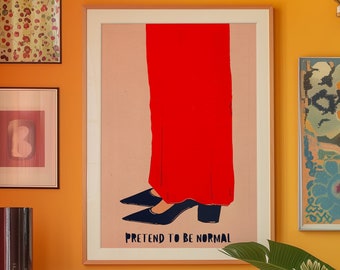 May include: A framed art print with a pink background and a red silhouette of a person wearing black shoes. The text "PRETEND TO BE NORMAL" is printed in blue below the image.