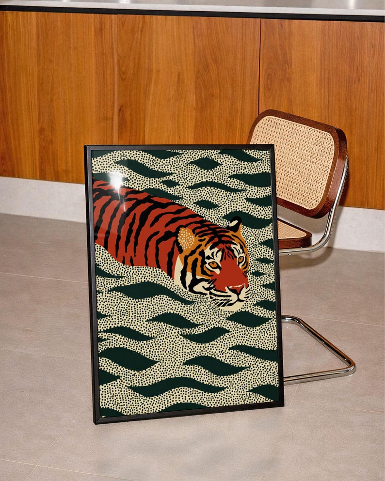 Stylized tiger illustration moving through abstract green wave patterns with dotted textures on a neutral background. The bold orange and black striped tiger contrasts with the rhythmic organic shapes, creating a dynamic maximalist composition. Hand drawn details and modern folk art influences give the artwork a playful yet powerful visual identity. Perfect for living room wall decor, kids room styling, eclectic interiors, or jungle themed spaces seeking a bold statement animal artwork.