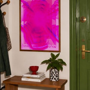 This pink glitch art print layers Greek and Roman statue busts in neon magenta, framed by retro typography and the phrase “What Is Yours Will Find You.” Repeated figures and digital distortion create a bold vaporwave collage with a surreal mood. Made to command attention in a bedroom, living room, studio or maximalist gallery wall, it adds electric color and bold attitude. A striking choice for collectors of classical sculpture, dopamine decor, Y2K graphics and uplifting quote posters.