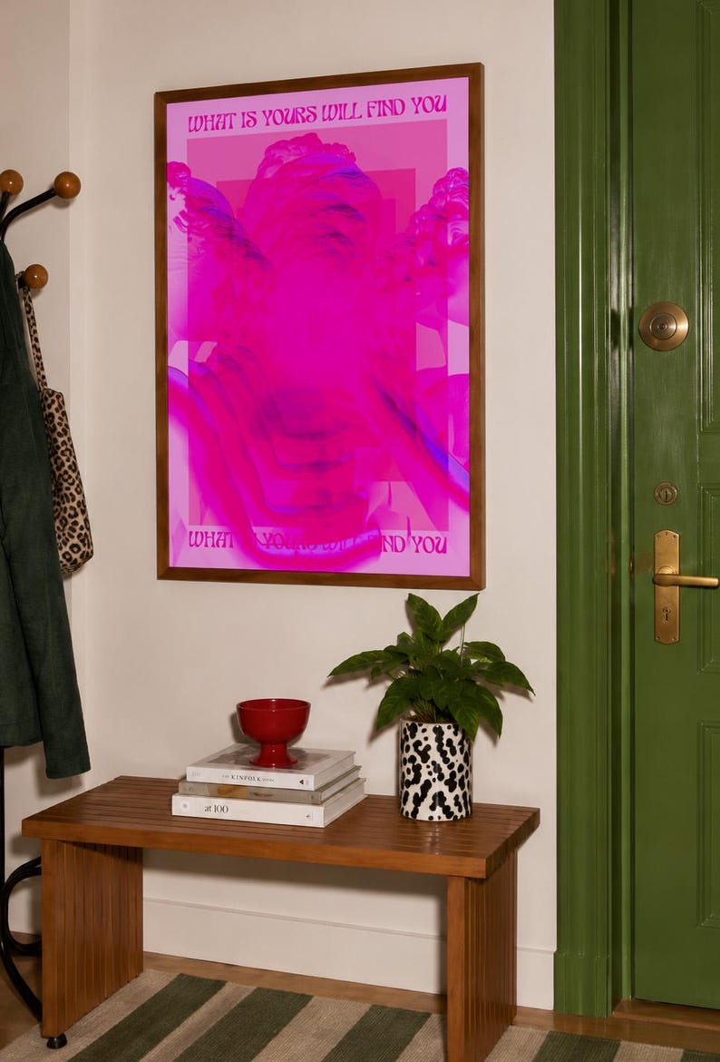 This pink glitch art print layers Greek and Roman statue busts in neon magenta, framed by retro typography and the phrase “What Is Yours Will Find You.” Repeated figures and digital distortion create a bold vaporwave collage with a surreal mood. Made to command attention in a bedroom, living room, studio or maximalist gallery wall, it adds electric color and bold attitude. A striking choice for collectors of classical sculpture, dopamine decor, Y2K graphics and uplifting quote posters.
