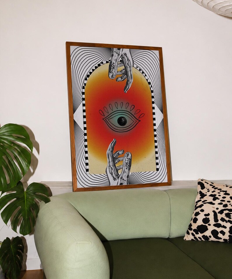All seeing eye poster featuring a surreal central eye, chrome hands, black-and-white optical lines and a fiery orange gradient in a psychedelic collage style. Display this trippy art print in a living room, bedroom, studio, dorm or eclectic gallery wall to create a bold focal point with graphic movement and retro energy. Designed for collectors of surrealism, optical art and unconventional interiors who enjoy mysterious symbolism, vivid color and artwork that immediately starts a conversation.