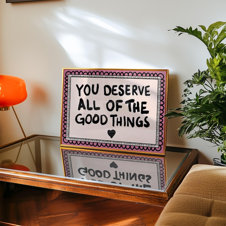 A heartwarming affirmation poster featuring the phrase You Deserve All Of The Good Things in hand-lettered black text with a pink and cream border. Perfect for self-love decor, home offices, or as a thoughtful gift. This piece adds positivity, encouragement, and warmth to any wall.You Deserve Poster, Self Love Wall Art, Positive Quote Print, Motivational Home Art, Pink Modern Poster, Inspirational Typography, Empowering Print, Daily Affirmation Art, Encouraging Quote, Feminine Room Print