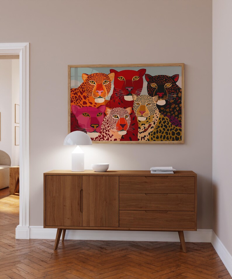 A vibrant maximalist illustration featuring a group of stylized leopards and panthers in bold red, orange, pink, and black tones. The artwork highlights expressive eyes, graphic patterns, and rich color contrasts, creating a striking statement piece inspired by modern folk art, dopamine decor, and eclectic interiors.Leopard Wall Art, Trendy Art Print, Big Cat Poster, Colorful Animal Art, Maximalist Decor, Wild Cat Design, Eclectic Home Art, Modern Folk Style, Red Aesthetic Poster, Dopamine Decor