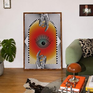 All seeing eye poster featuring a surreal central eye, chrome hands, black-and-white optical lines and a fiery orange gradient in a psychedelic collage style. Display this trippy art print in a living room, bedroom, studio, dorm or eclectic gallery wall to create a bold focal point with graphic movement and retro energy. Designed for collectors of surrealism, optical art and unconventional interiors who enjoy mysterious symbolism, vivid color and artwork that immediately starts a conversation.