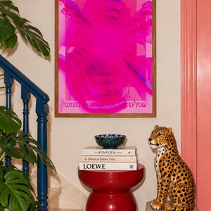 This pink glitch art print layers Greek and Roman statue busts in neon magenta, framed by retro typography and the phrase “What Is Yours Will Find You.” Repeated figures and digital distortion create a bold vaporwave collage with a surreal mood. Made to command attention in a bedroom, living room, studio or maximalist gallery wall, it adds electric color and bold attitude. A striking choice for collectors of classical sculpture, dopamine decor, Y2K graphics and uplifting quote posters.