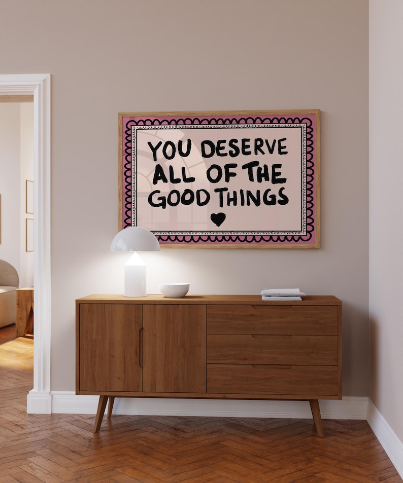 A heartwarming affirmation poster featuring the phrase You Deserve All Of The Good Things in hand-lettered black text with a pink and cream border. Perfect for self-love decor, home offices, or as a thoughtful gift. This piece adds positivity, encouragement, and warmth to any wall.You Deserve Poster, Self Love Wall Art, Positive Quote Print, Motivational Home Art, Pink Modern Poster, Inspirational Typography, Empowering Print, Daily Affirmation Art, Encouraging Quote, Feminine Room Print
