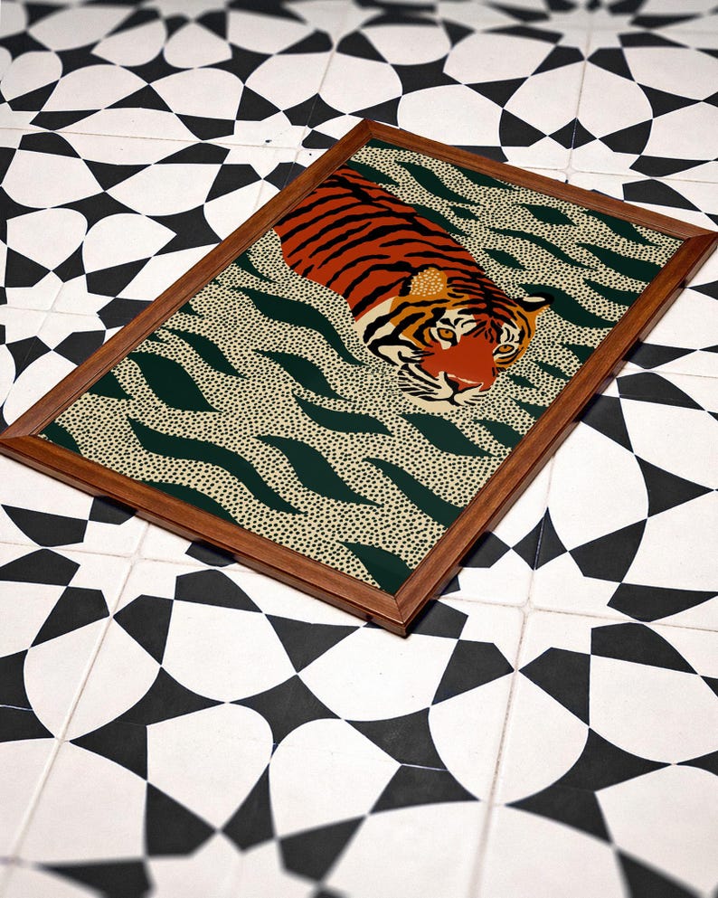 Stylized tiger illustration moving through abstract green wave patterns with dotted textures on a neutral background. The bold orange and black striped tiger contrasts with the rhythmic organic shapes, creating a dynamic maximalist composition. Hand drawn details and modern folk art influences give the artwork a playful yet powerful visual identity. Perfect for living room wall decor, kids room styling, eclectic interiors, or jungle themed spaces seeking a bold statement animal artwork.