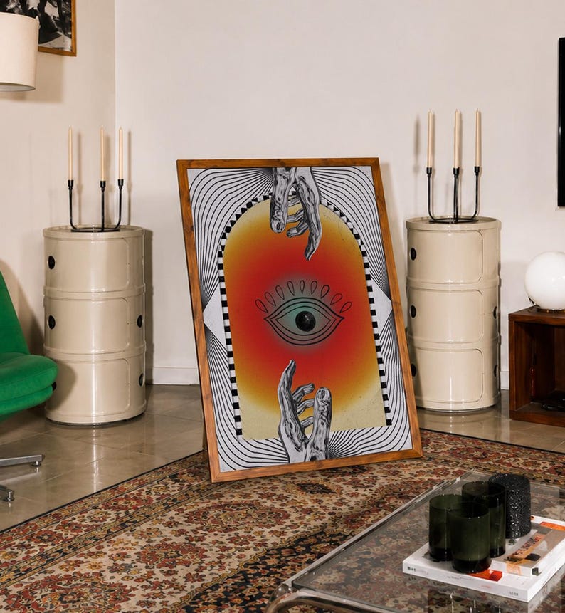 All seeing eye poster featuring a surreal central eye, chrome hands, black-and-white optical lines and a fiery orange gradient in a psychedelic collage style. Display this trippy art print in a living room, bedroom, studio, dorm or eclectic gallery wall to create a bold focal point with graphic movement and retro energy. Designed for collectors of surrealism, optical art and unconventional interiors who enjoy mysterious symbolism, vivid color and artwork that immediately starts a conversation.