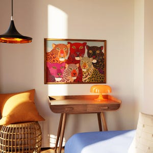 A vibrant maximalist illustration featuring a group of stylized leopards and panthers in bold red, orange, pink, and black tones. The artwork highlights expressive eyes, graphic patterns, and rich color contrasts, creating a striking statement piece inspired by modern folk art, dopamine decor, and eclectic interiors.Leopard Wall Art, Trendy Art Print, Big Cat Poster, Colorful Animal Art, Maximalist Decor, Wild Cat Design, Eclectic Home Art, Modern Folk Style, Red Aesthetic Poster, Dopamine Decor