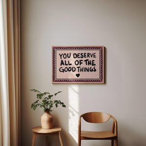 A heartwarming affirmation poster featuring the phrase You Deserve All Of The Good Things in hand-lettered black text with a pink and cream border. Perfect for self-love decor, home offices, or as a thoughtful gift. This piece adds positivity, encouragement, and warmth to any wall.You Deserve Poster, Self Love Wall Art, Positive Quote Print, Motivational Home Art, Pink Modern Poster, Inspirational Typography, Empowering Print, Daily Affirmation Art, Encouraging Quote, Feminine Room Print