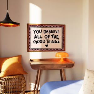 A heartwarming affirmation poster featuring the phrase You Deserve All Of The Good Things in hand-lettered black text with a pink and cream border. Perfect for self-love decor, home offices, or as a thoughtful gift. This piece adds positivity, encouragement, and warmth to any wall.You Deserve Poster, Self Love Wall Art, Positive Quote Print, Motivational Home Art, Pink Modern Poster, Inspirational Typography, Empowering Print, Daily Affirmation Art, Encouraging Quote, Feminine Room Print