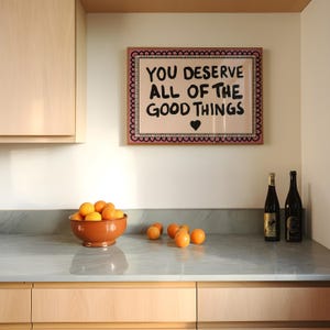 A heartwarming affirmation poster featuring the phrase You Deserve All Of The Good Things in hand-lettered black text with a pink and cream border. Perfect for self-love decor, home offices, or as a thoughtful gift. This piece adds positivity, encouragement, and warmth to any wall.You Deserve Poster, Self Love Wall Art, Positive Quote Print, Motivational Home Art, Pink Modern Poster, Inspirational Typography, Empowering Print, Daily Affirmation Art, Encouraging Quote, Feminine Room Print