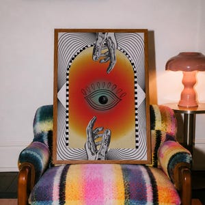 All seeing eye poster featuring a surreal central eye, chrome hands, black-and-white optical lines and a fiery orange gradient in a psychedelic collage style. Display this trippy art print in a living room, bedroom, studio, dorm or eclectic gallery wall to create a bold focal point with graphic movement and retro energy. Designed for collectors of surrealism, optical art and unconventional interiors who enjoy mysterious symbolism, vivid color and artwork that immediately starts a conversation.