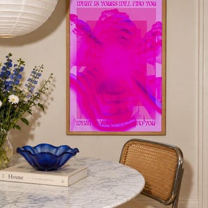 This pink glitch art print layers Greek and Roman statue busts in neon magenta, framed by retro typography and the phrase “What Is Yours Will Find You.” Repeated figures and digital distortion create a bold vaporwave collage with a surreal mood. Made to command attention in a bedroom, living room, studio or maximalist gallery wall, it adds electric color and bold attitude. A striking choice for collectors of classical sculpture, dopamine decor, Y2K graphics and uplifting quote posters.