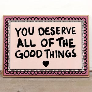 A heartwarming affirmation poster featuring the phrase You Deserve All Of The Good Things in hand-lettered black text with a pink and cream border. Perfect for self-love decor, home offices, or as a thoughtful gift. This piece adds positivity, encouragement, and warmth to any wall.You Deserve Poster, Self Love Wall Art, Positive Quote Print, Motivational Home Art, Pink Modern Poster, Inspirational Typography, Empowering Print, Daily Affirmation Art, Encouraging Quote, Feminine Room Print