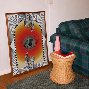 All seeing eye poster featuring a surreal central eye, chrome hands, black-and-white optical lines and a fiery orange gradient in a psychedelic collage style. Display this trippy art print in a living room, bedroom, studio, dorm or eclectic gallery wall to create a bold focal point with graphic movement and retro energy. Designed for collectors of surrealism, optical art and unconventional interiors who enjoy mysterious symbolism, vivid color and artwork that immediately starts a conversation.