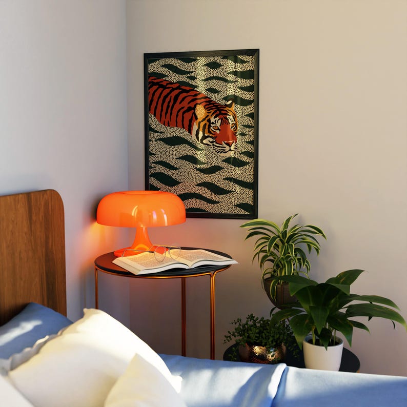 Stylized tiger illustration moving through abstract green wave patterns with dotted textures on a neutral background. The bold orange and black striped tiger contrasts with the rhythmic organic shapes, creating a dynamic maximalist composition. Hand drawn details and modern folk art influences give the artwork a playful yet powerful visual identity. Perfect for living room wall decor, kids room styling, eclectic interiors, or jungle themed spaces seeking a bold statement animal artwork.