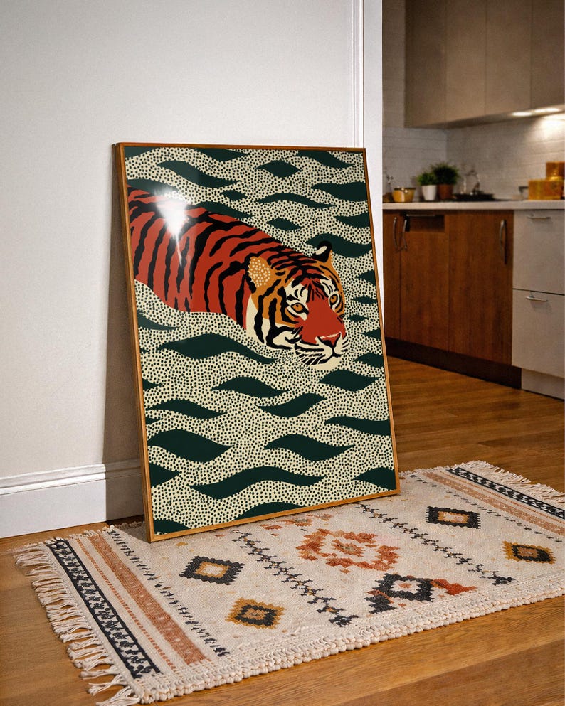 Stylized tiger illustration moving through abstract green wave patterns with dotted textures on a neutral background. The bold orange and black striped tiger contrasts with the rhythmic organic shapes, creating a dynamic maximalist composition. Hand drawn details and modern folk art influences give the artwork a playful yet powerful visual identity. Perfect for living room wall decor, kids room styling, eclectic interiors, or jungle themed spaces seeking a bold statement animal artwork.