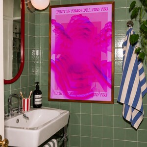 This pink glitch art print layers Greek and Roman statue busts in neon magenta, framed by retro typography and the phrase “What Is Yours Will Find You.” Repeated figures and digital distortion create a bold vaporwave collage with a surreal mood. Made to command attention in a bedroom, living room, studio or maximalist gallery wall, it adds electric color and bold attitude. A striking choice for collectors of classical sculpture, dopamine decor, Y2K graphics and uplifting quote posters.