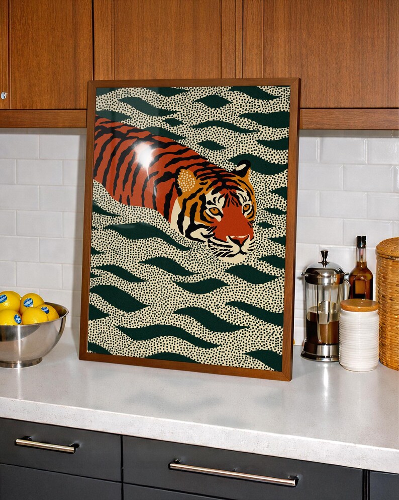 Stylized tiger illustration moving through abstract green wave patterns with dotted textures on a neutral background. The bold orange and black striped tiger contrasts with the rhythmic organic shapes, creating a dynamic maximalist composition. Hand drawn details and modern folk art influences give the artwork a playful yet powerful visual identity. Perfect for living room wall decor, kids room styling, eclectic interiors, or jungle themed spaces seeking a bold statement animal artwork.