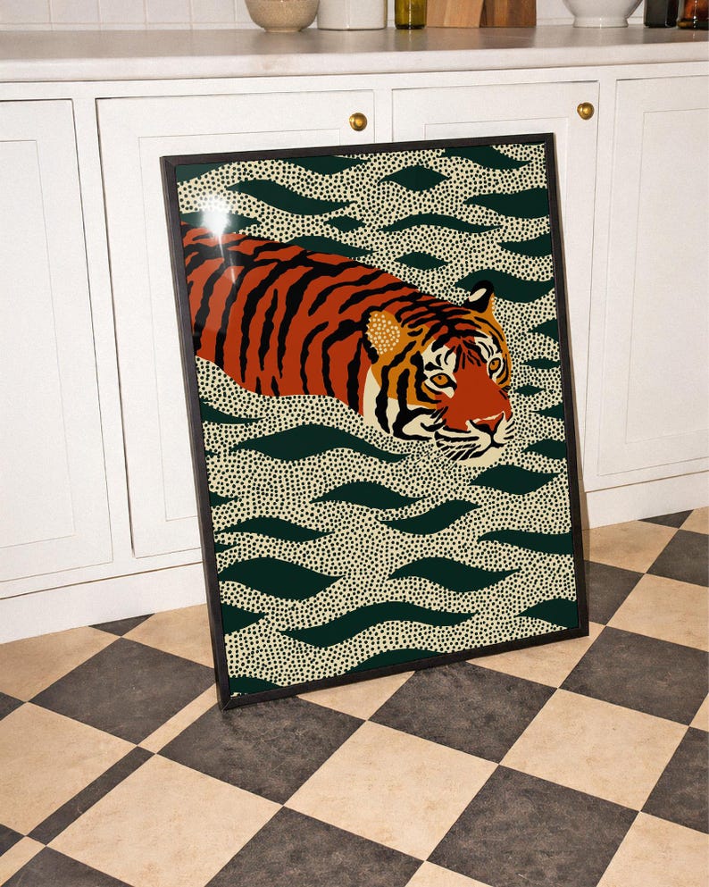 Stylized tiger illustration moving through abstract green wave patterns with dotted textures on a neutral background. The bold orange and black striped tiger contrasts with the rhythmic organic shapes, creating a dynamic maximalist composition. Hand drawn details and modern folk art influences give the artwork a playful yet powerful visual identity. Perfect for living room wall decor, kids room styling, eclectic interiors, or jungle themed spaces seeking a bold statement animal artwork.
