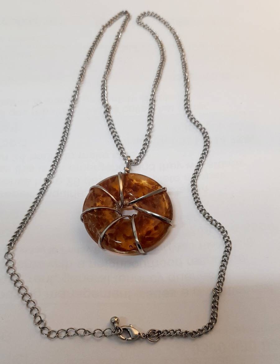 Lovely Vintage pre owned wire wrapped art glass wheel pendant on long silver chain.