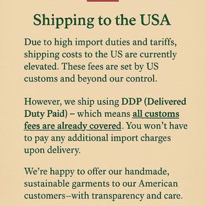 May include: Text on a beige background with a small American flag in the top center. The text reads "Shipping to the USA" and explains import duties and tariffs, and that customs fees are covered. The message is a thank you to customers.