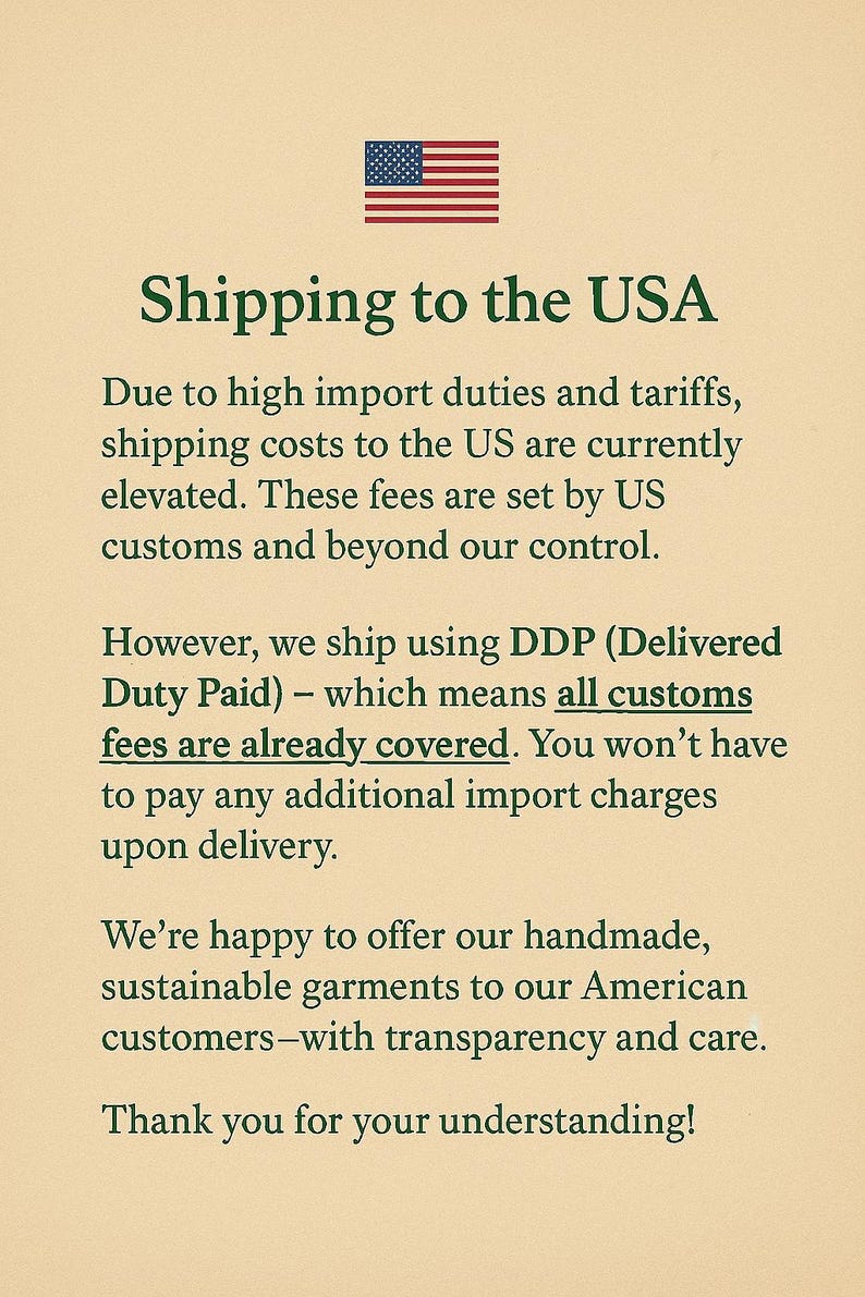 May include: Text on a beige background with a small American flag in the top center. The text reads "Shipping to the USA" and explains import duties and tariffs, and that customs fees are covered. The message is a thank you to customers.