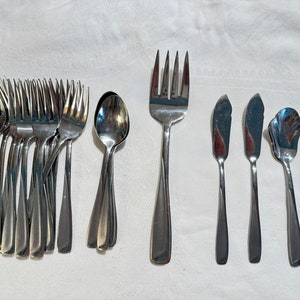 May include: A set of silverware, including forks, spoons, and butter knives. The silverware is made of stainless steel and has a polished finish.