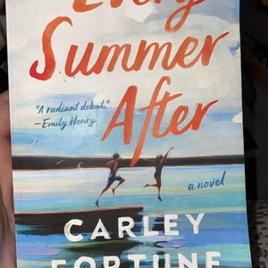 May include: A book cover with the title "Every Summer After" in large orange letters. The cover art depicts two figures jumping into water. The author's name, Carley Fortune, is printed at the bottom.