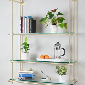 Full brass shelving unit using multiple connectors and tubes.