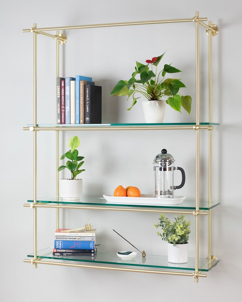 Full brass shelving unit using multiple connectors and tubes.